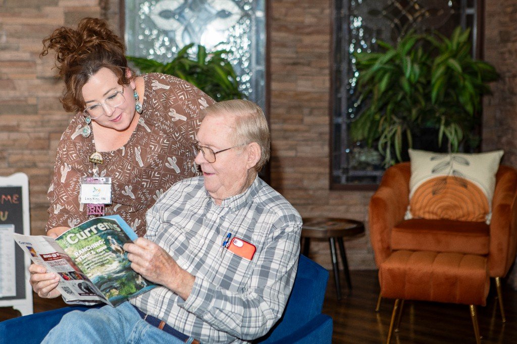 A care team member sharing a warm moment with a resident at Hummingbird Senior Resort Living
